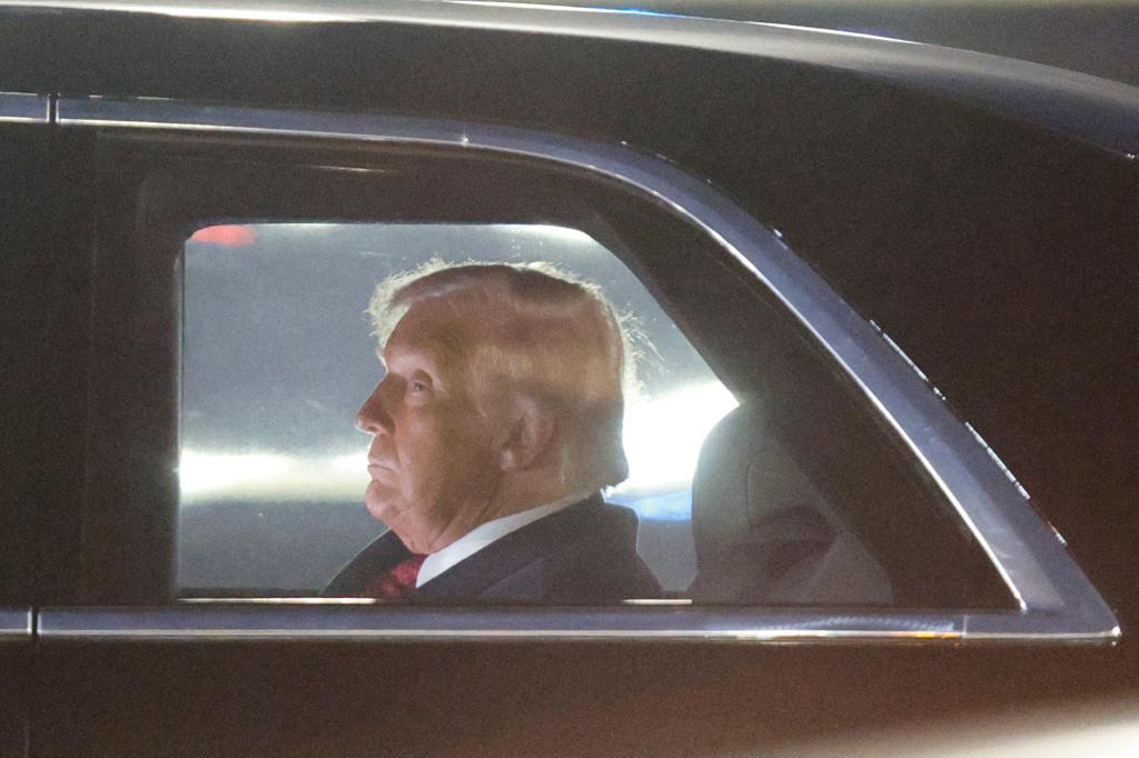 President Donald Trump is seen in his limousine