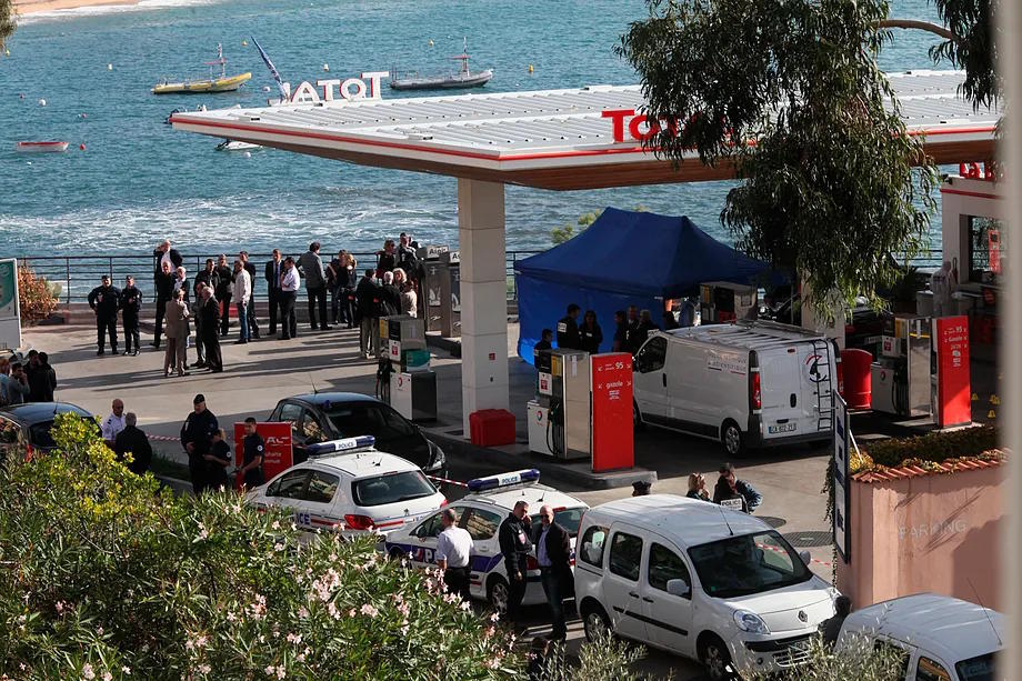 Police investigate a gas station after the murder of Antoine Sollacaro, near Ajaccio, Corsica, in 2012.