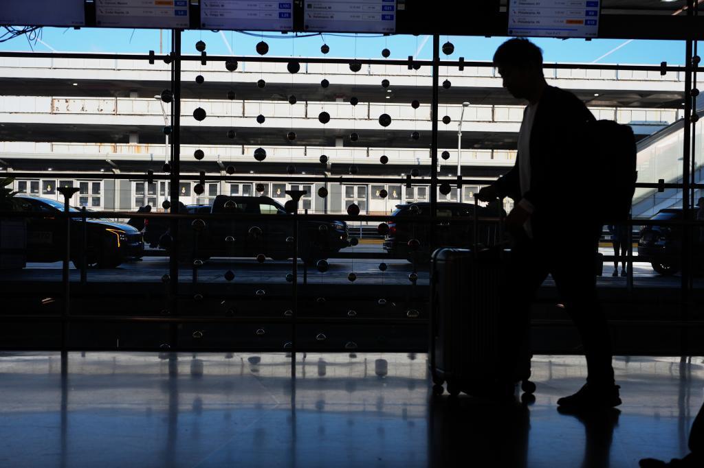 A traveler arrives at O'Hare International Airport in Chicago