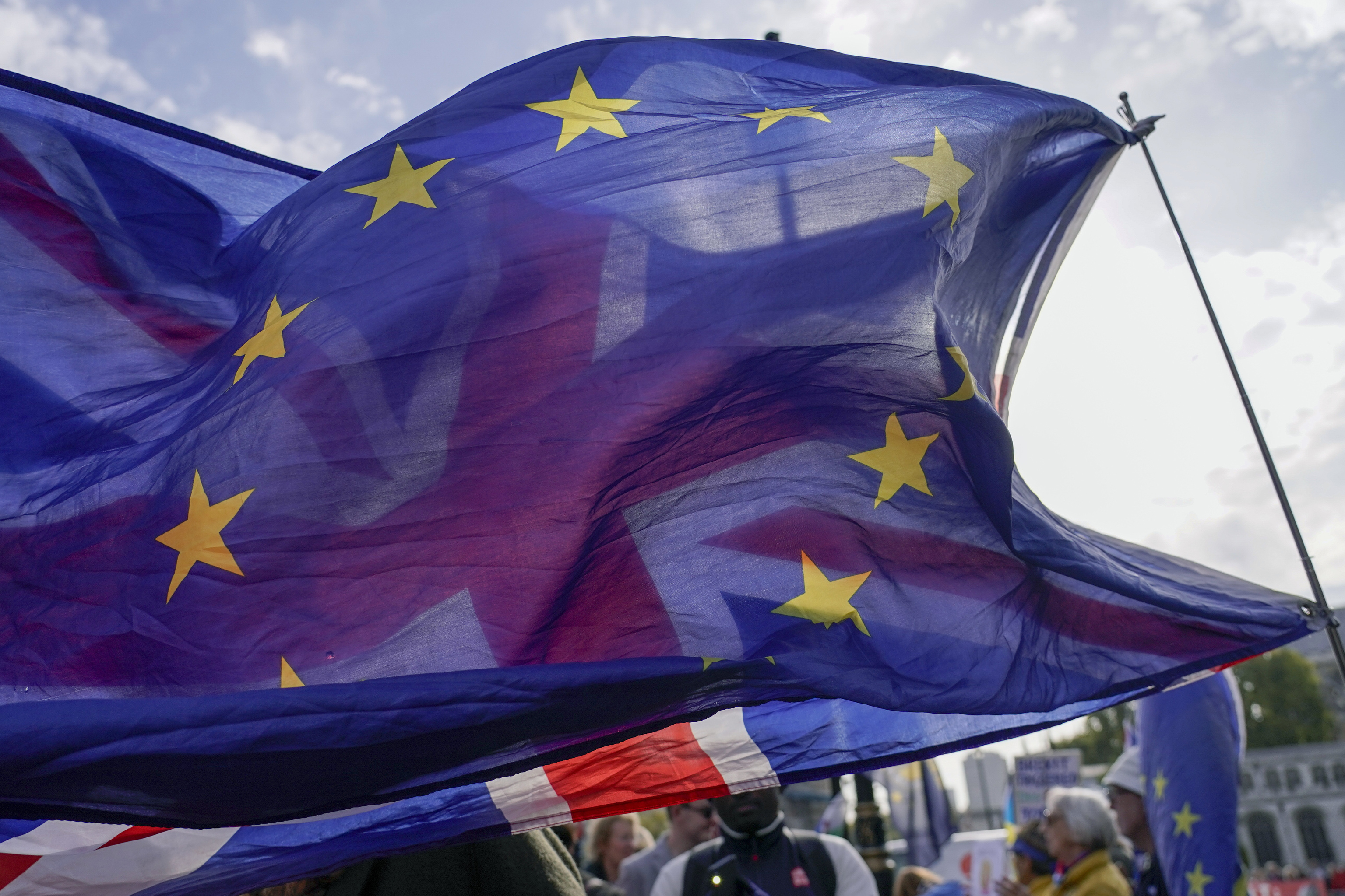 A Union flag waves behind a European Union flag.