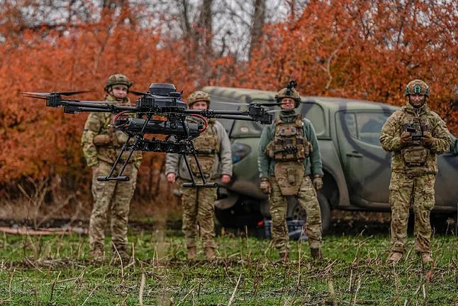 Ukrainian soldiers with a 'vampire drone'.