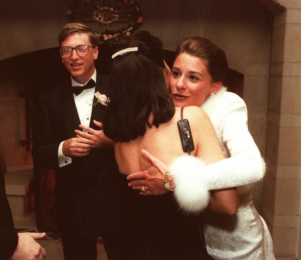 Computer mogul Bill Gates III and bride Melinda French greet guests in a reception line at a private estate in Seattle