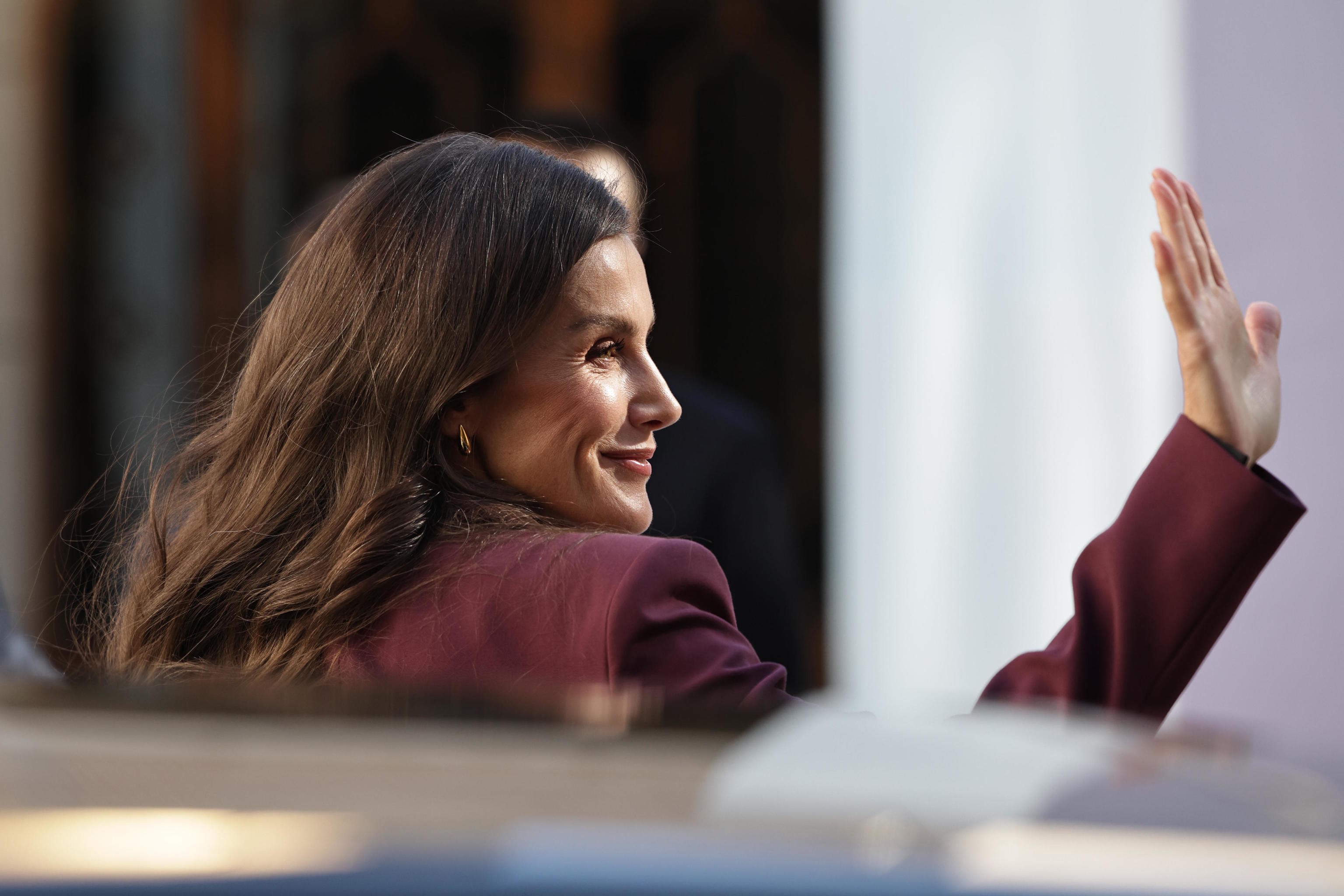 Spain's Queen Letizia greets people on her arrival at the Beijing.