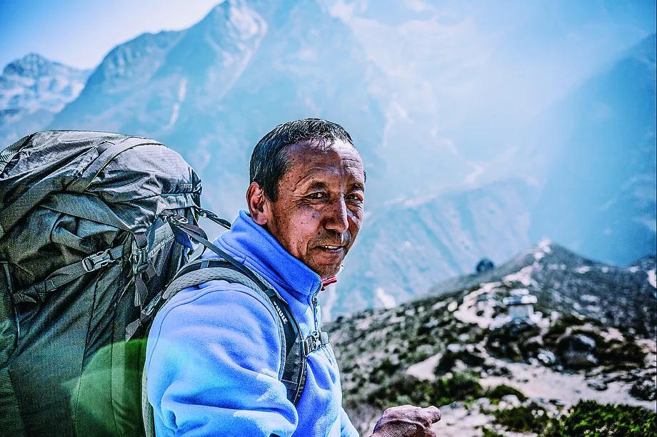 Apa Sherpa looks at the camera somewhere in the Himalayas.