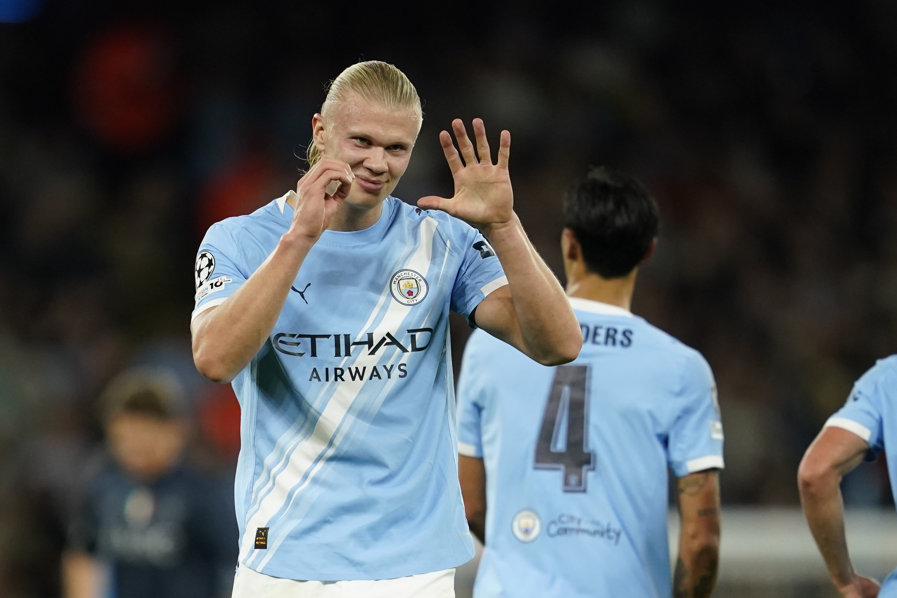 Manchester City's Erling Haaland celebrates after scoring the opening goal during the Champions League.