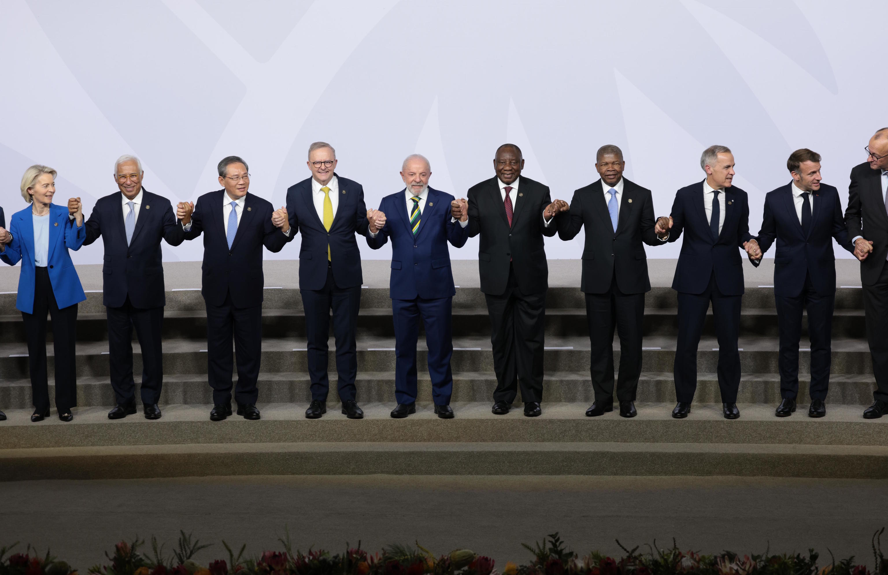 Leaders pose for a group photo on the opening day of the G20 Leaders' Summit.