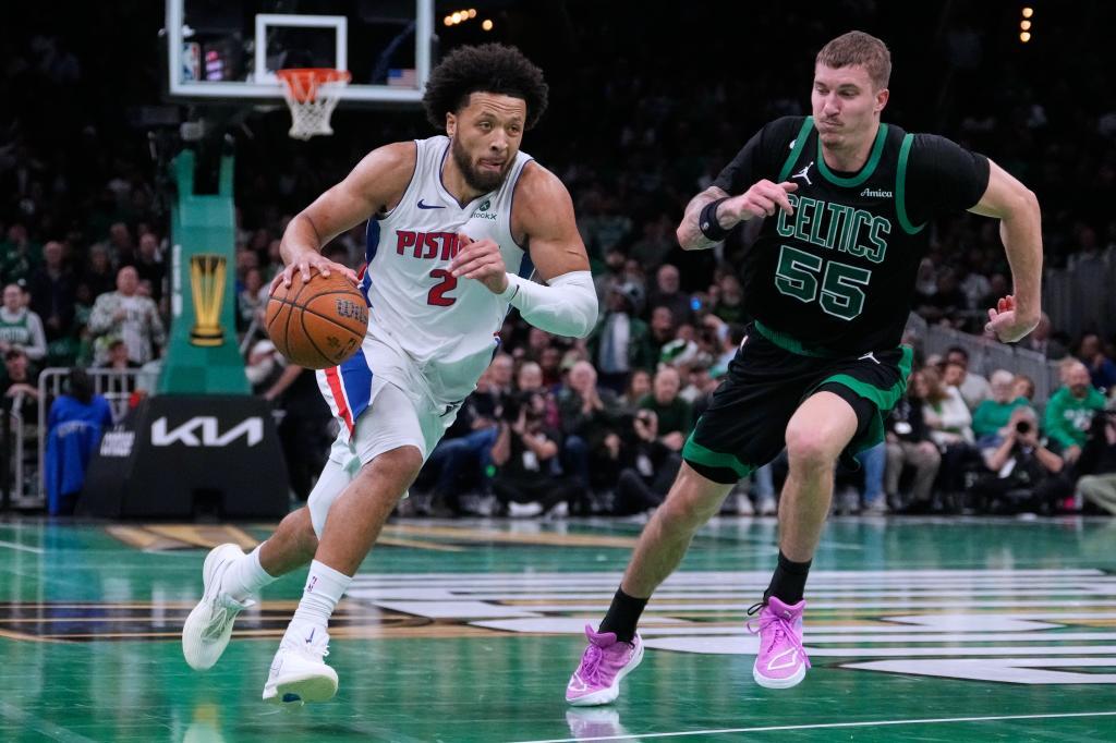 Detroit Pistons guard Cade Cunningham (2) drives past Boston Celtics guard Baylor Scheierman (55)