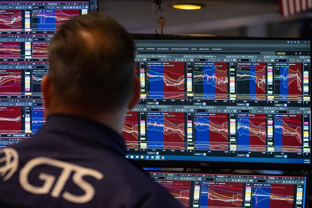 A Trader works on the floor of the New York Stock Exchange