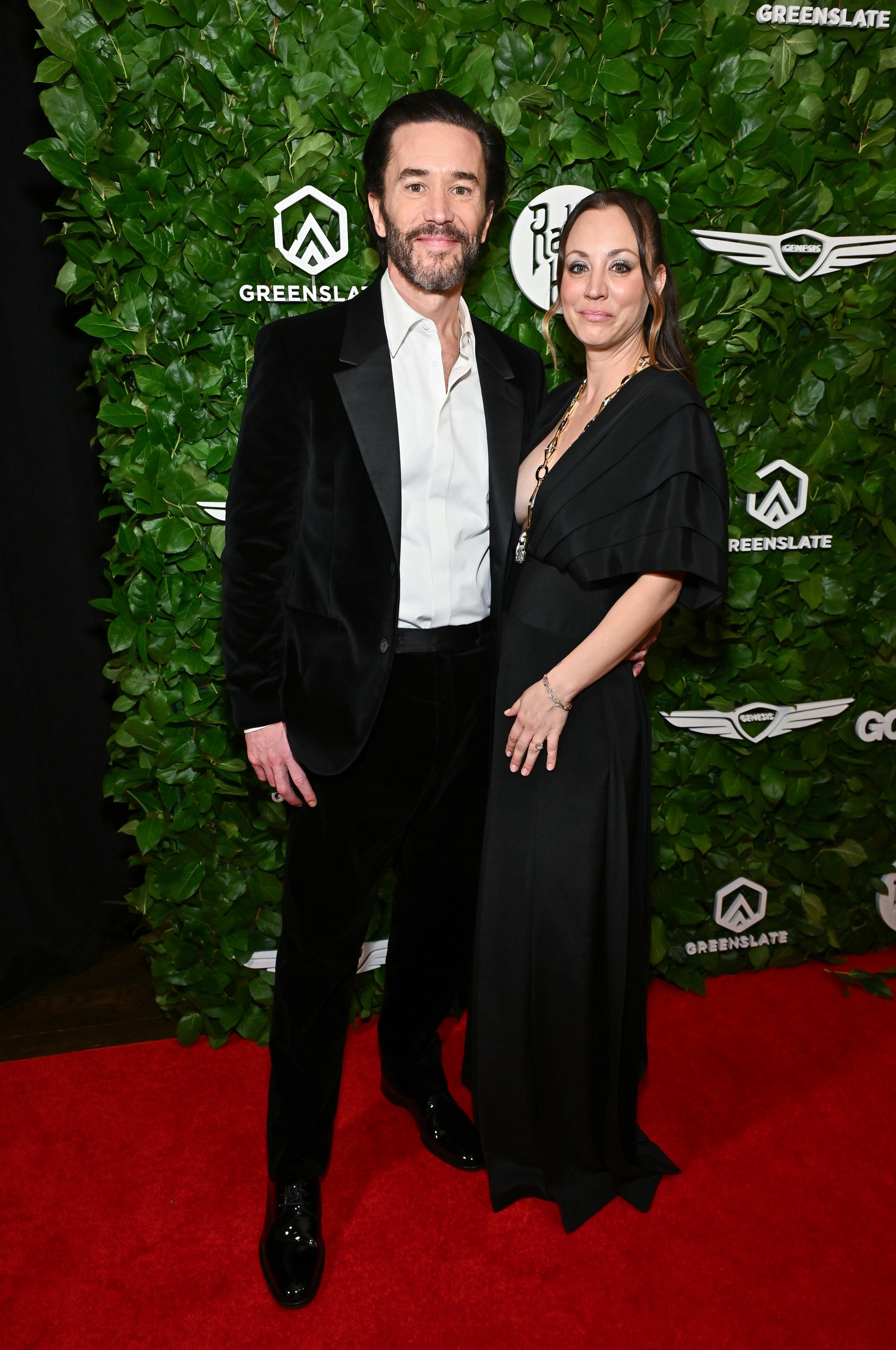 Tom Pelphrey, left, and Kaley Cuoco pose together.