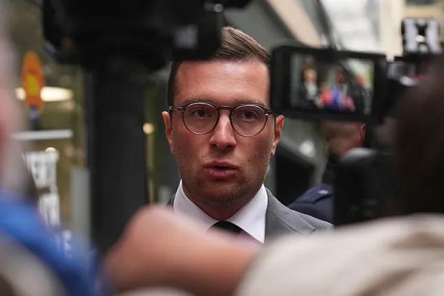 National Rally's president, Bardella, speaks to the press in Paris, last October.