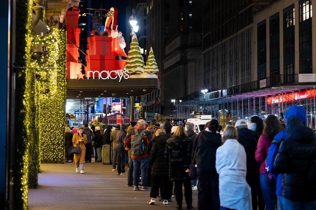 Black Friday Shoppers wait in line to enter Macy's flagship store