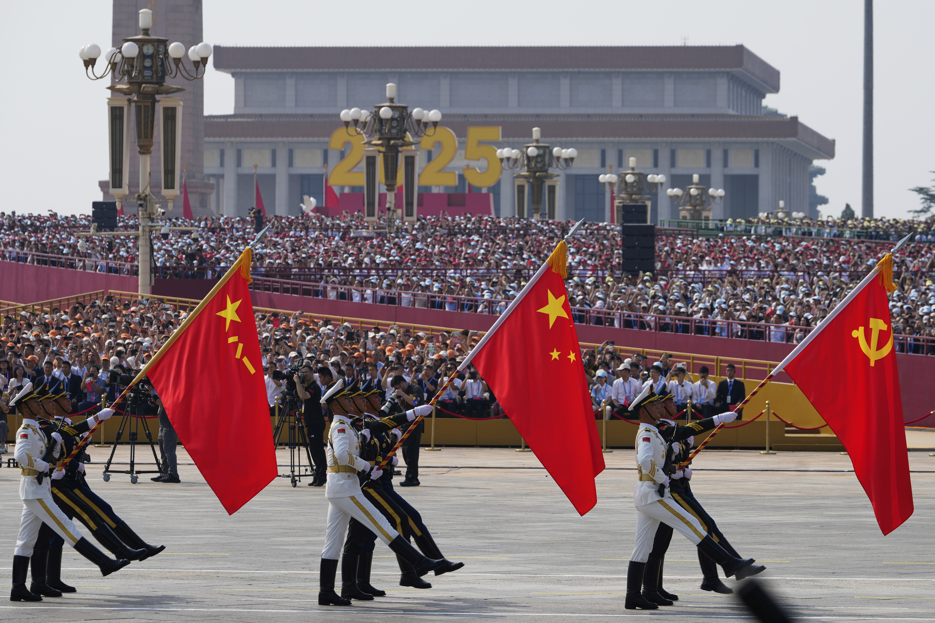 Military personnel take part in a military parade to commemorate the 80th anniversary of Japan's World War II surrender.
