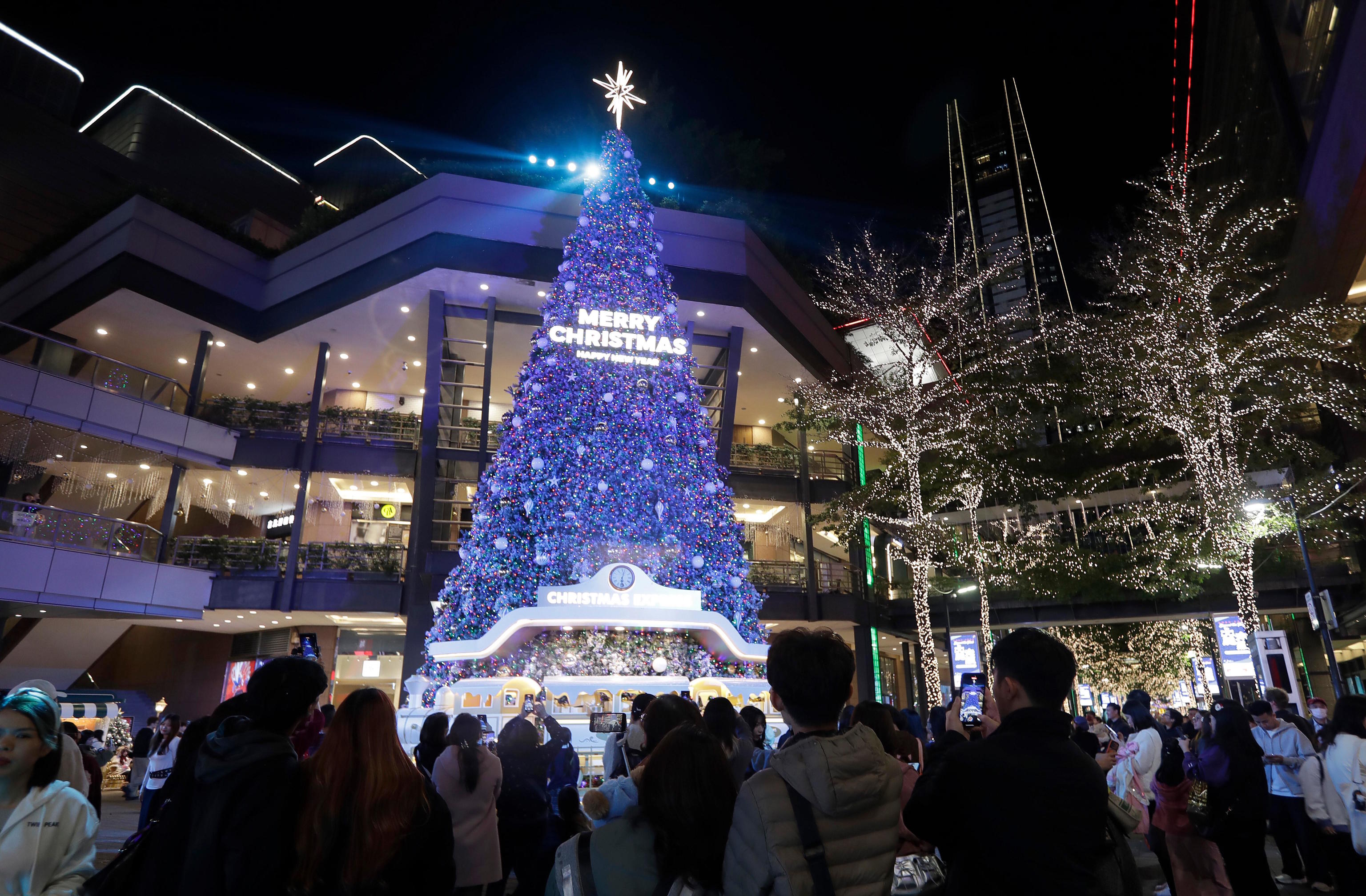 People take photos with Christmas decorations in Taipei.
