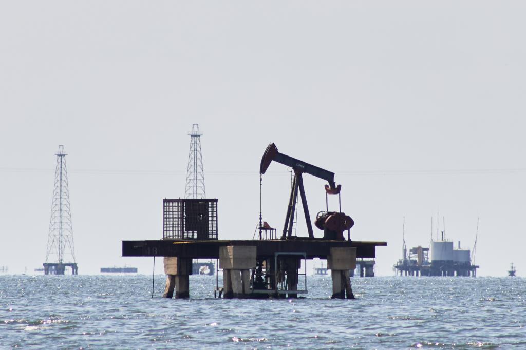 An oil pump jack stands unused in Cabimas.