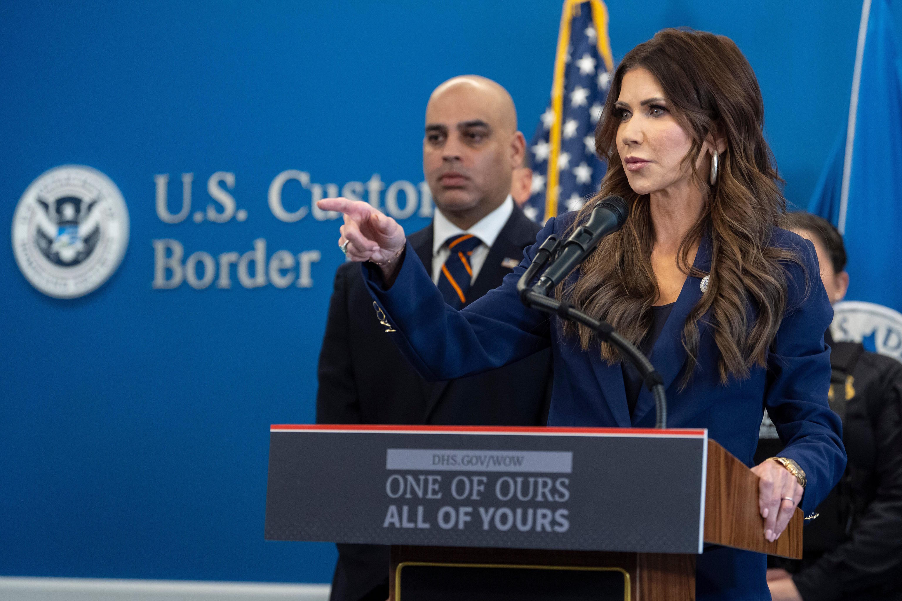 U.S. Homeland Security Secretary Kristi Noem points during a news conference.