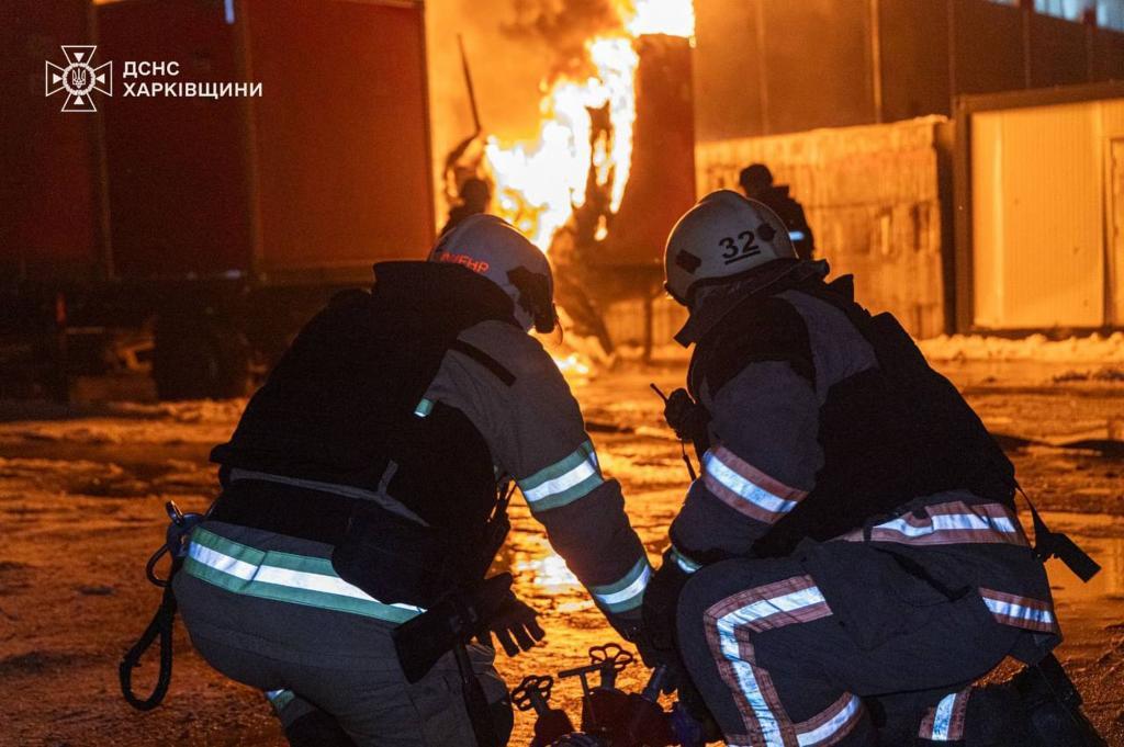 Ukrainian Emergency Service, emergency services personnel work to extinguish a fire following a Russian attack in Kharkiv