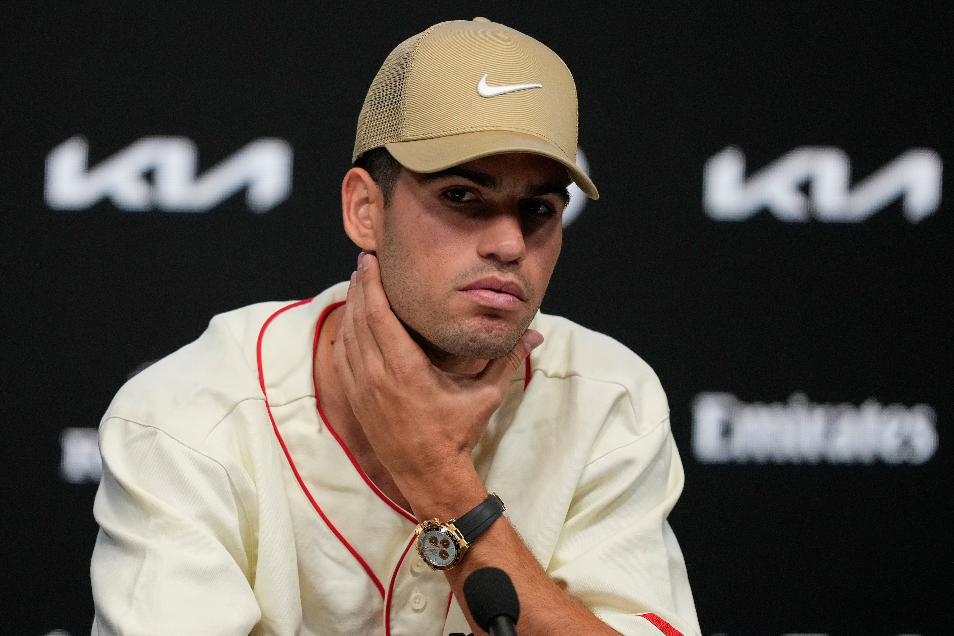 Carlos Alcaraz of Spain reacts during a press conference.