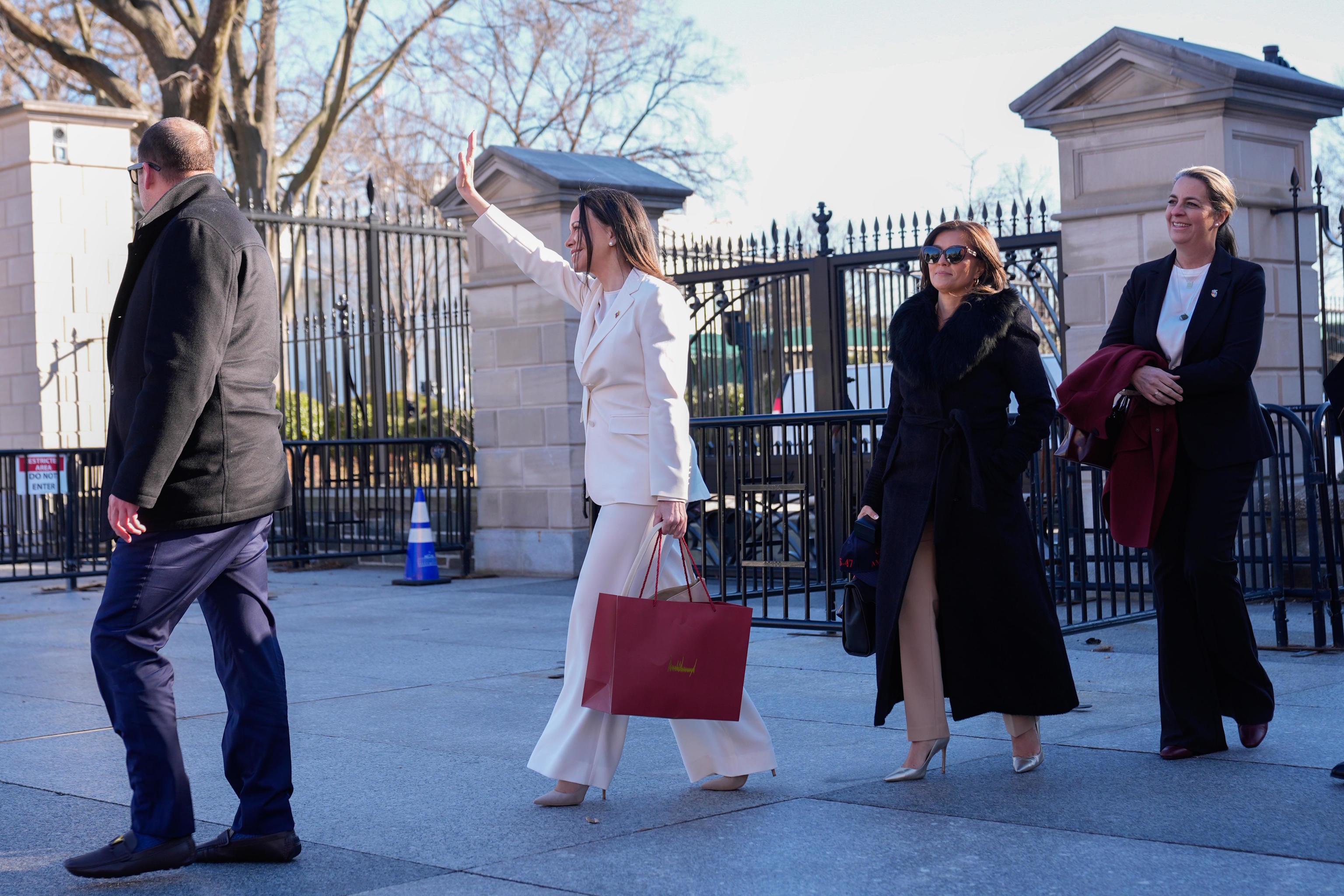 Marina Corina leaves the White House after meeting with President Trump.
