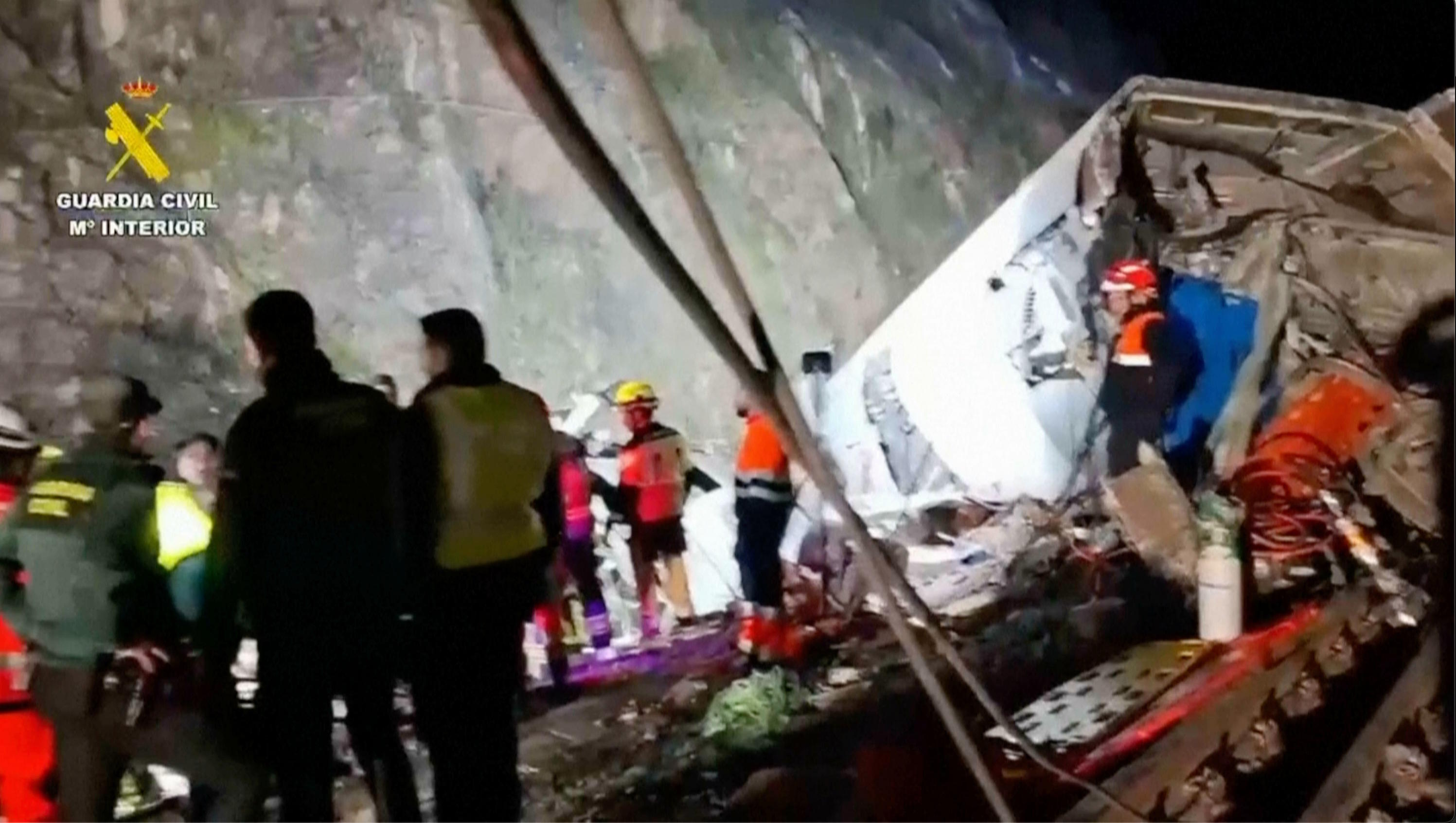 Rescuers on the scene after a high-speed train collision in Córdoba, Spain.