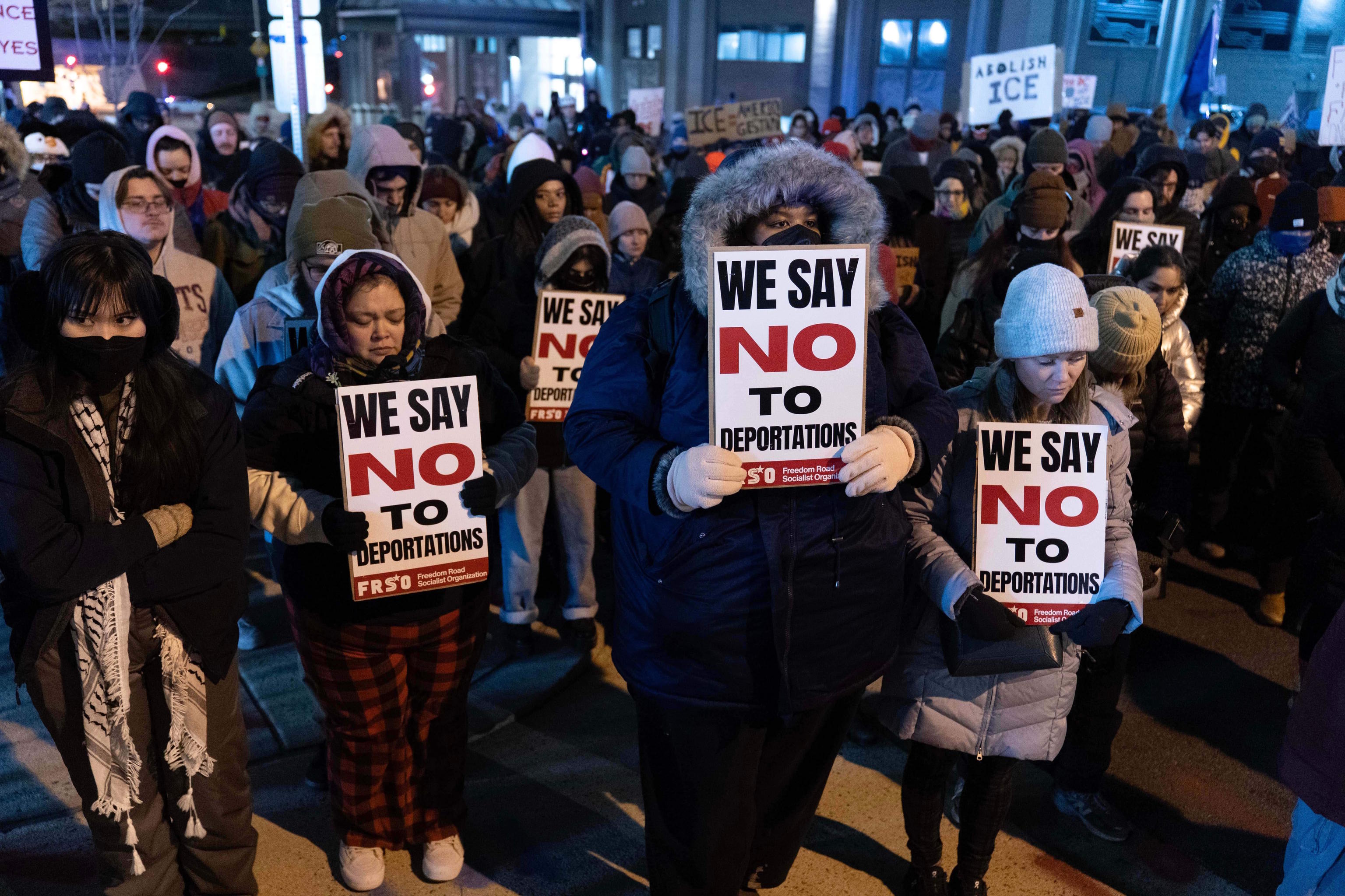 Demonstrators hold a moment of silence for Alex Jeffrey Pretti.