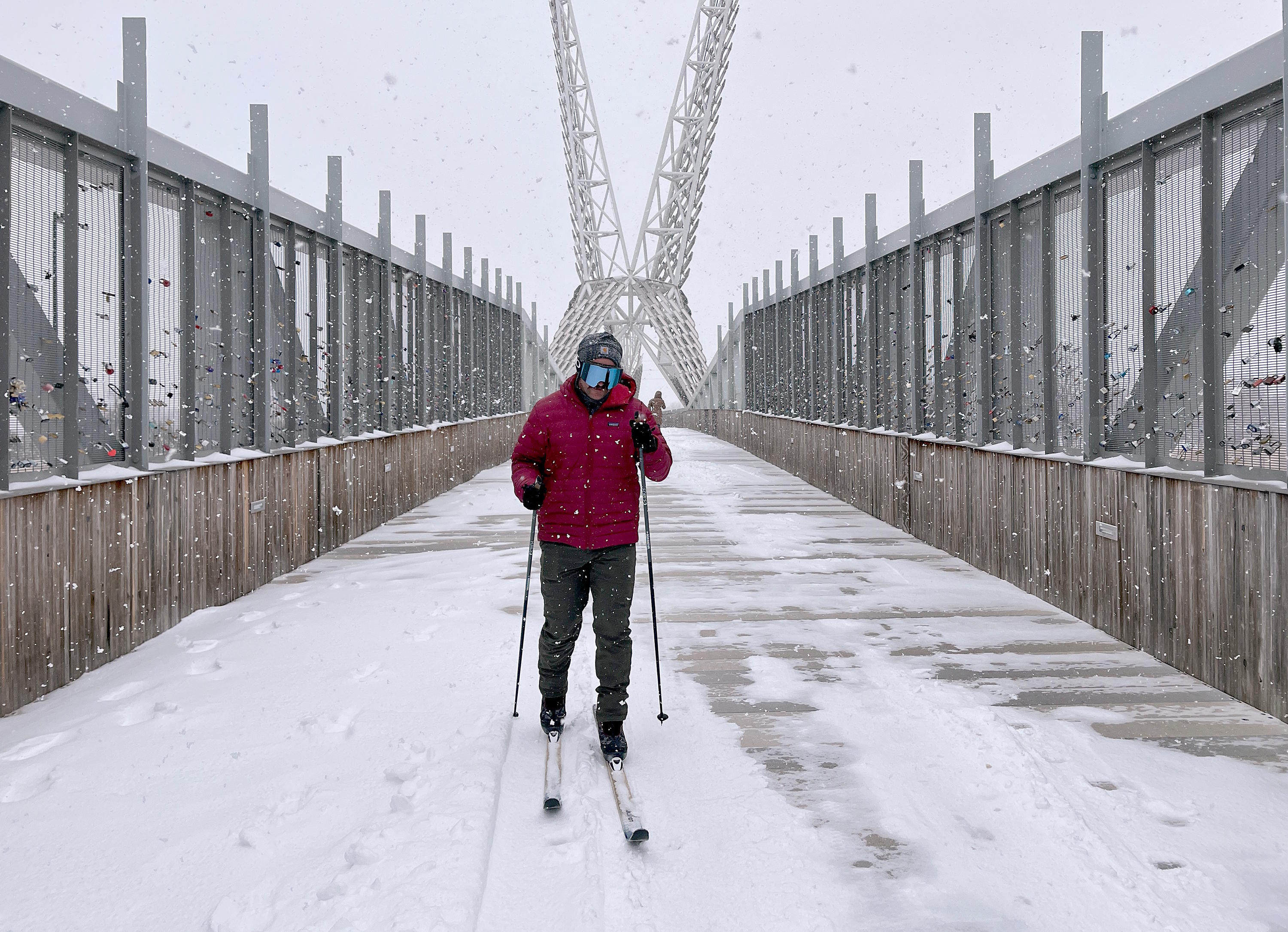 A man skis over the SkyDance Bridge during a snowstorm in Oklahoma City.