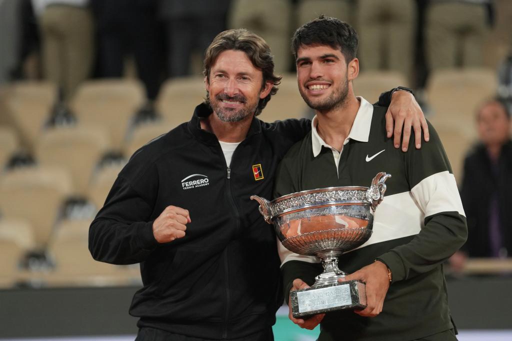 Spain's Carlos Alcaraz, right, poses with his coach Juan Carlos Ferrero