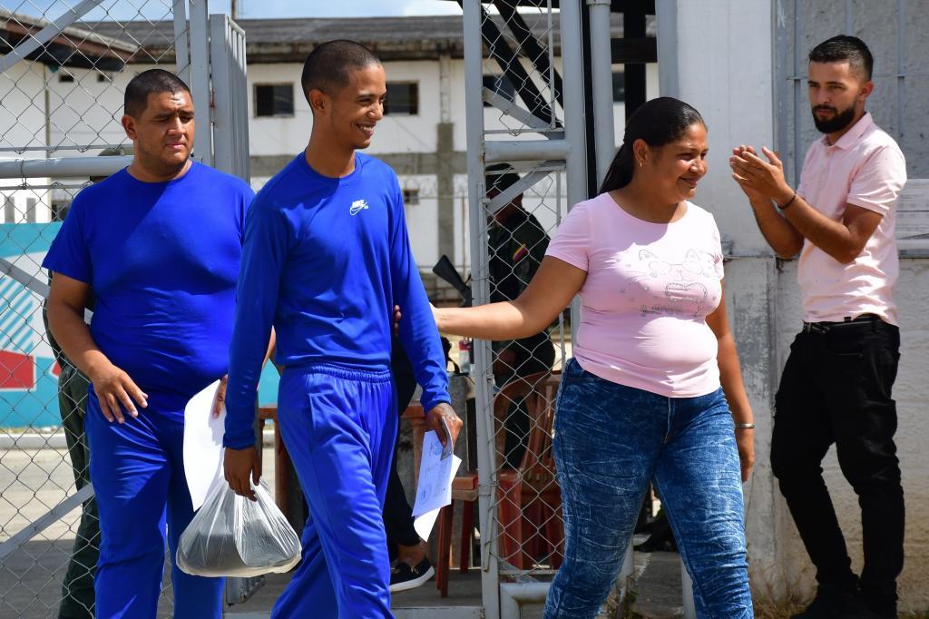 Ricardo G�mez, left, leaves prison after being released.