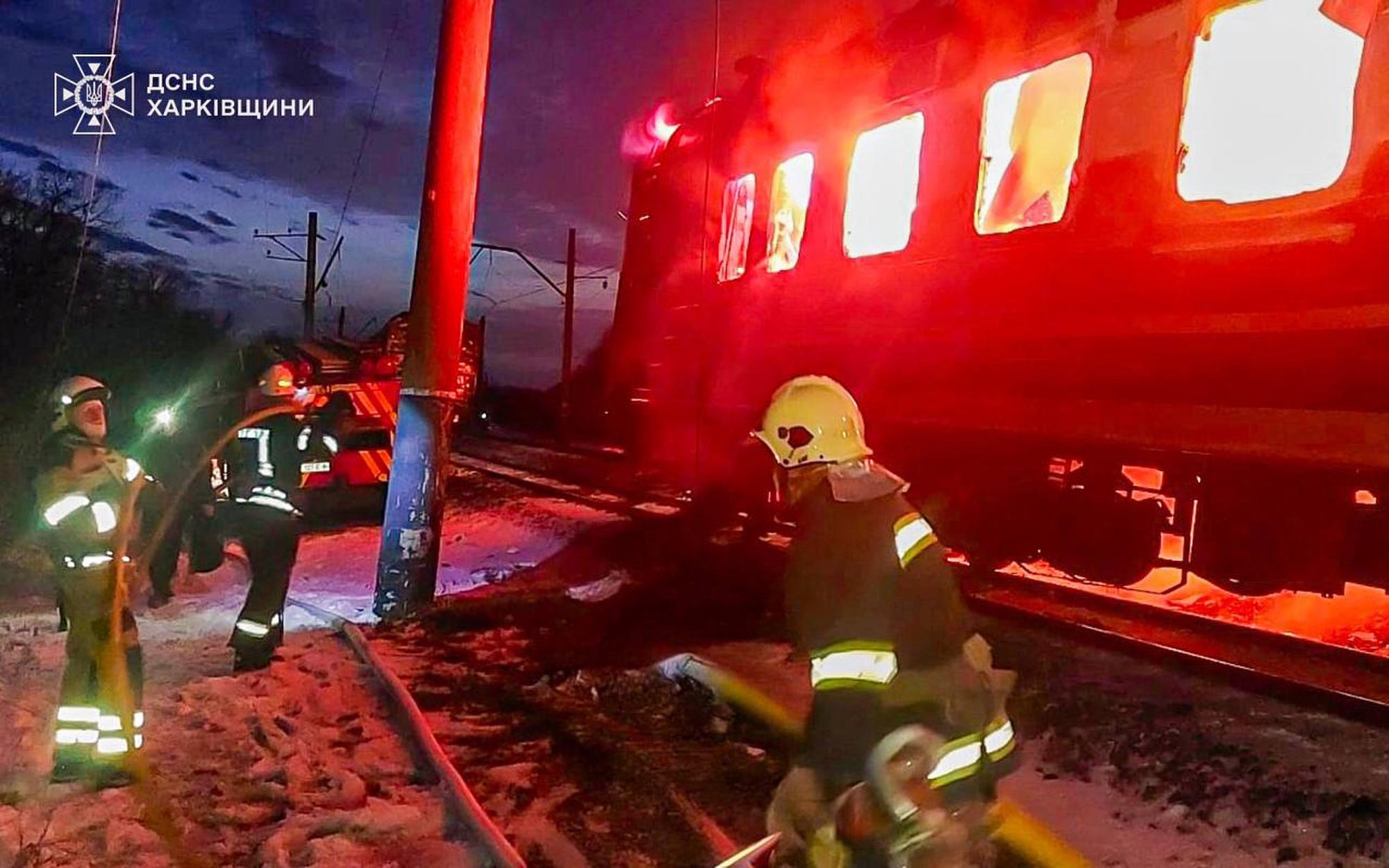 Firefighters put out the fire after Russian drones hit a passenger train.
