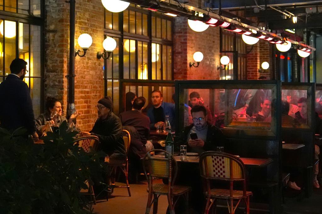 Diners eat at a restaurant in the Meatpacking District of Manhattan