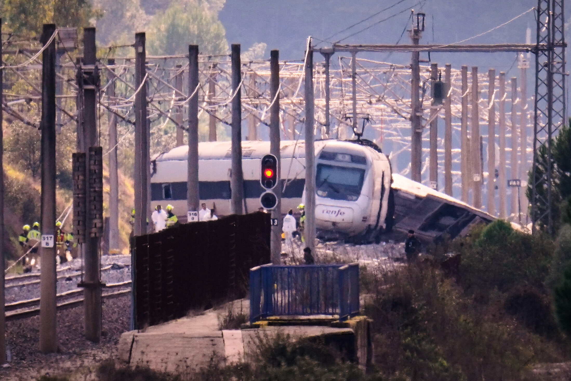 Emergency crews work at the site of a train collision in Adamuz, southern Spain.