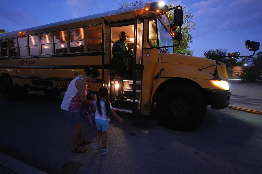 Pre-K 4 SA students arrive to catch an early morning school bus