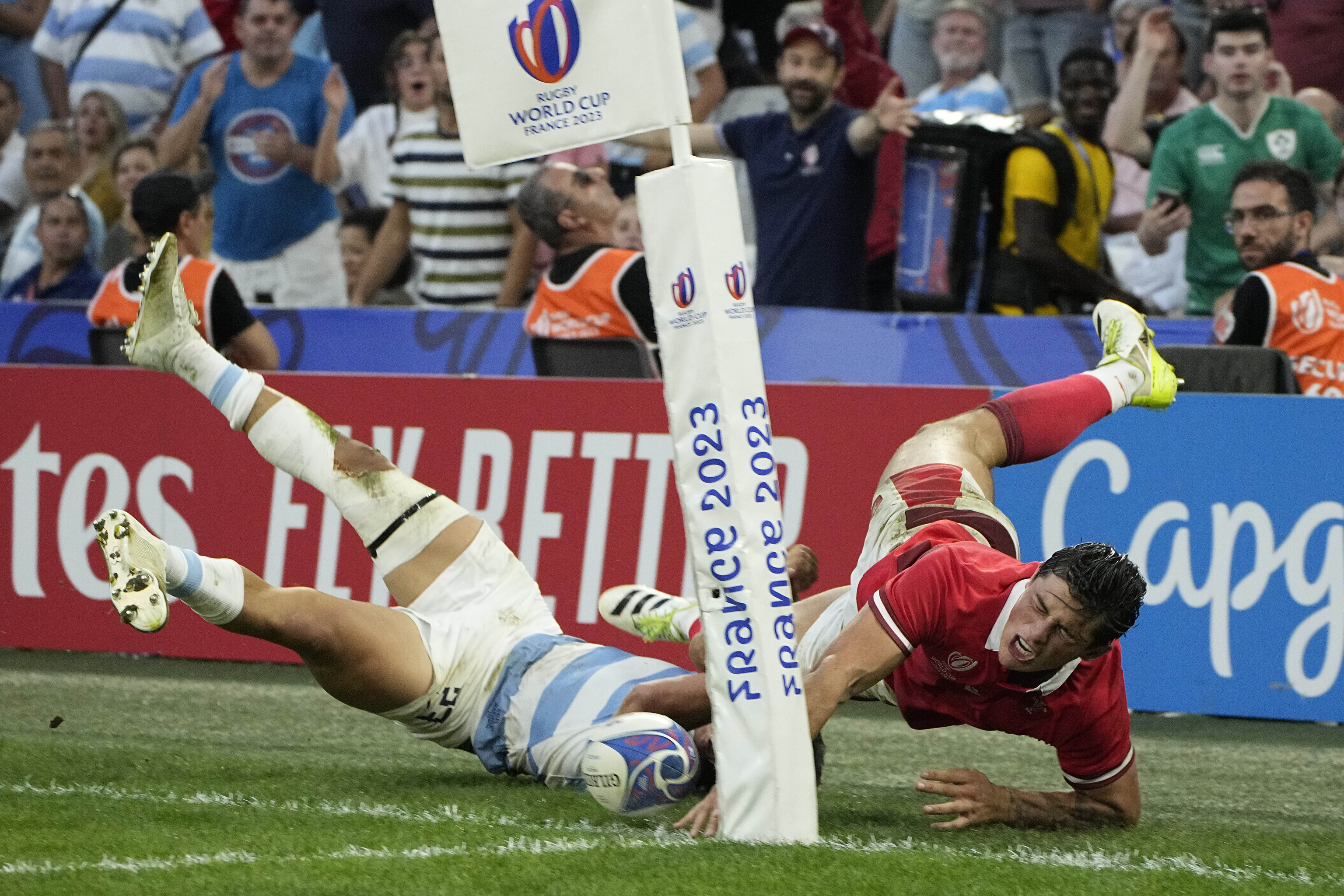 Argentina's Matias Moroni, left, tackles Wales' Louis Rees-Zammit.