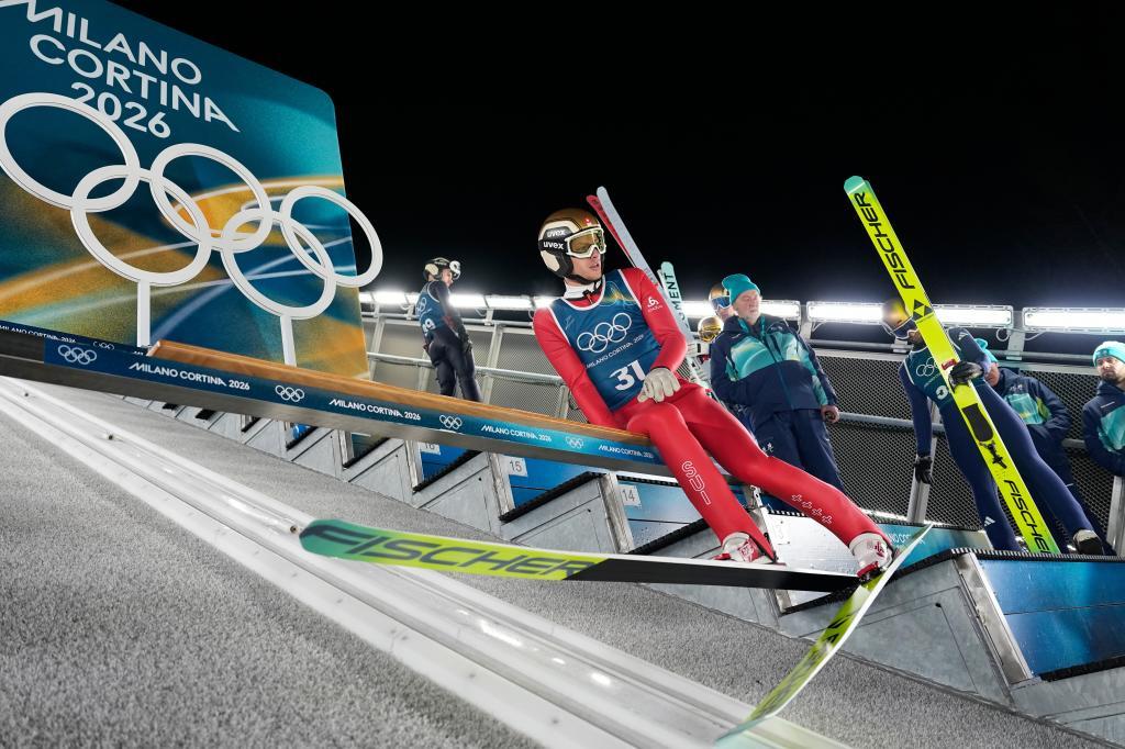 Felix Trunz, of Switzerland, takes his position for a jump during a ski jumping.