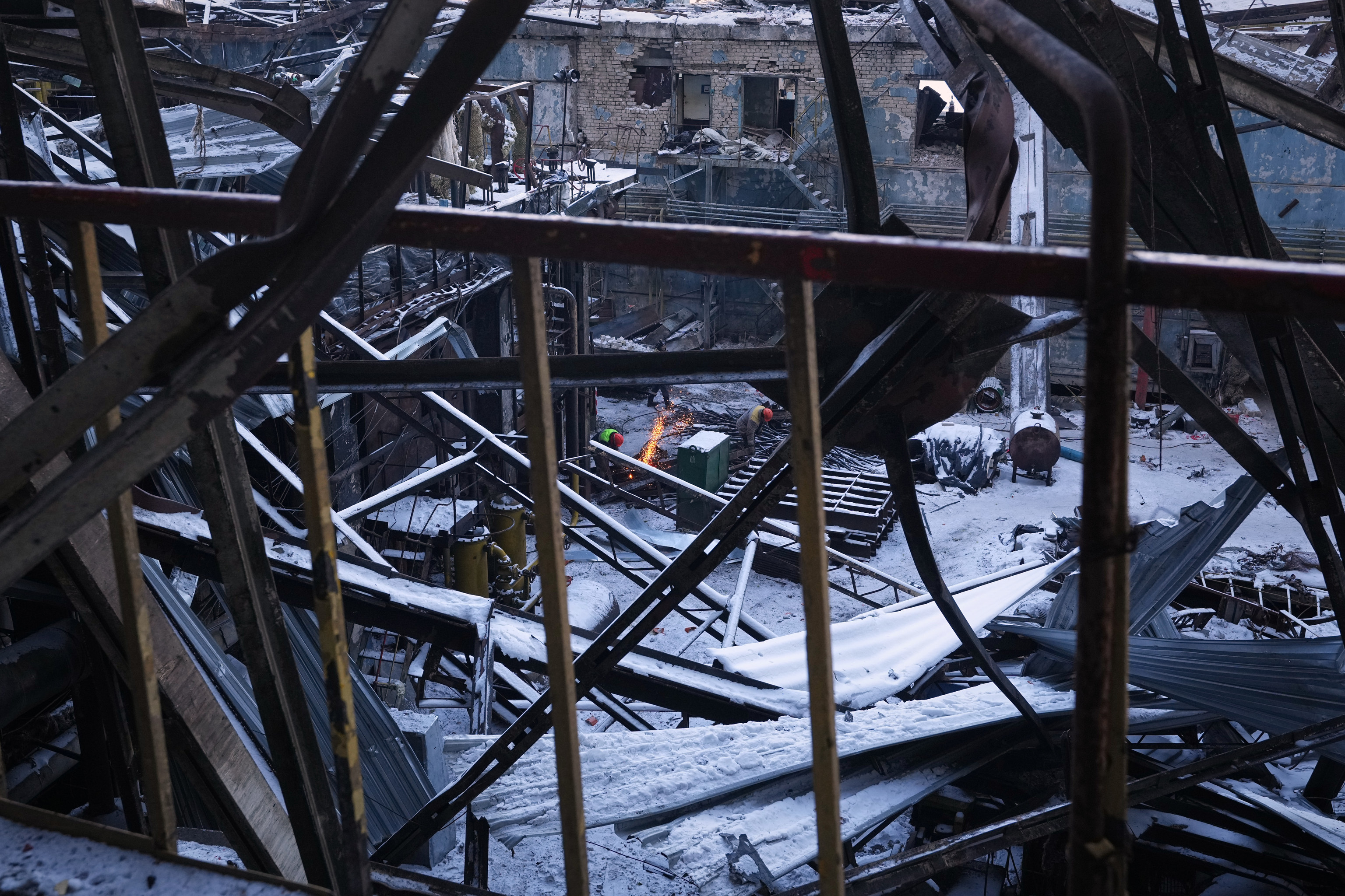 Workers repair the DTEK company's power plant destroyed by a Russian missile attack.