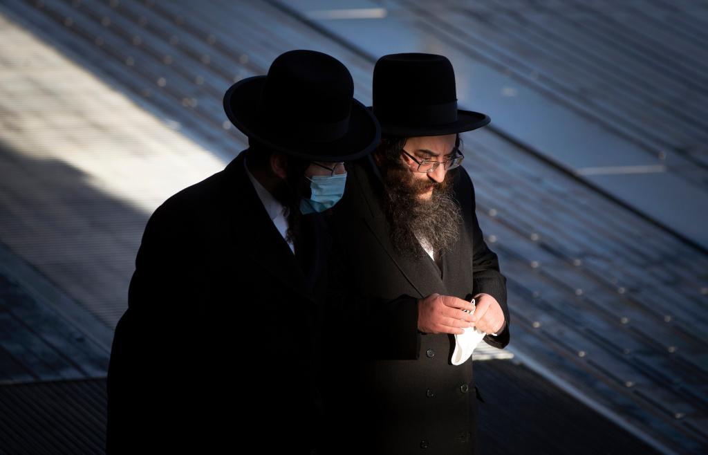 Two ultra-Orthodox Jewish men walk in Antwerp.