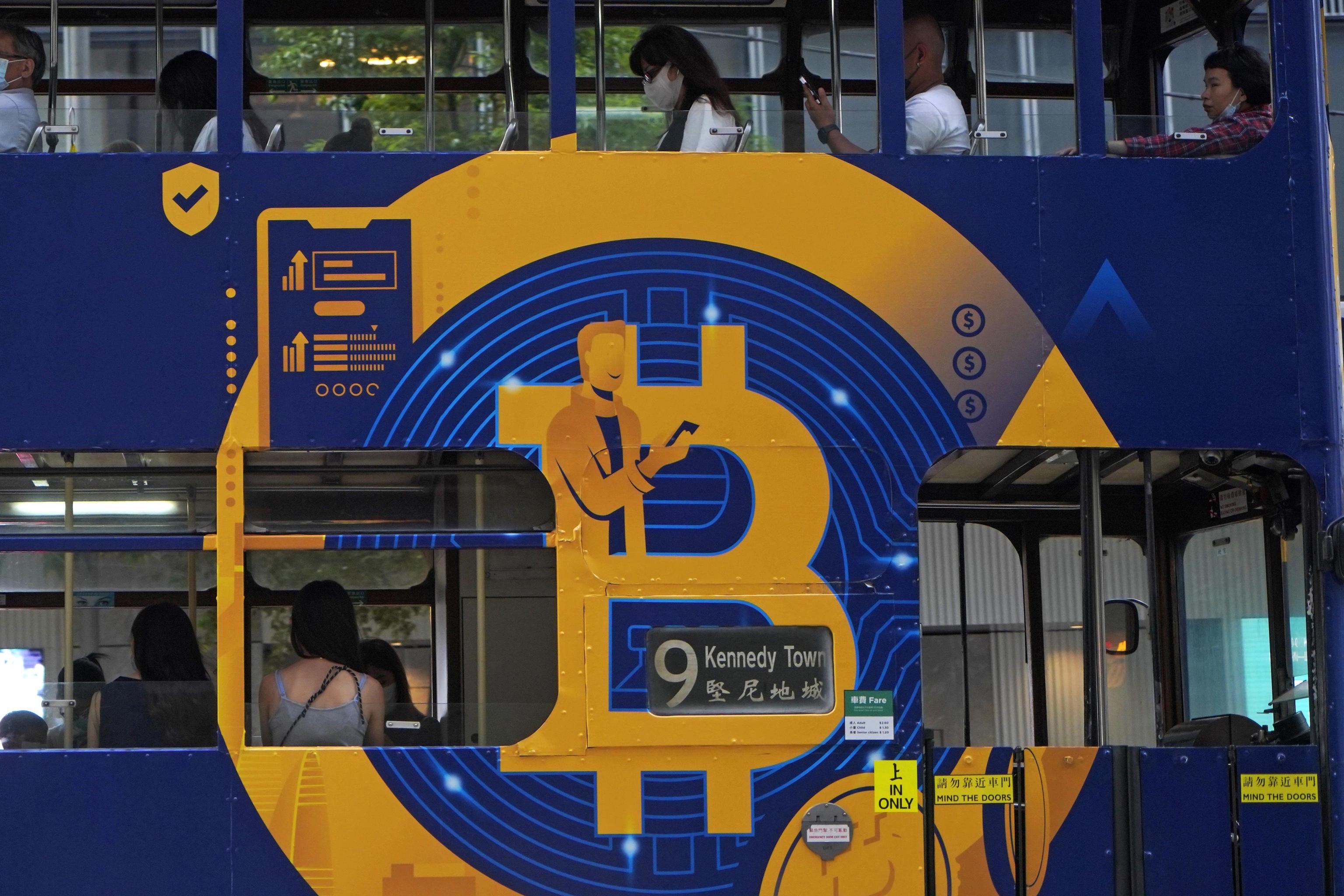An advertisement for the cryptocurrency Bitcoin on a bus in Hong Kong.