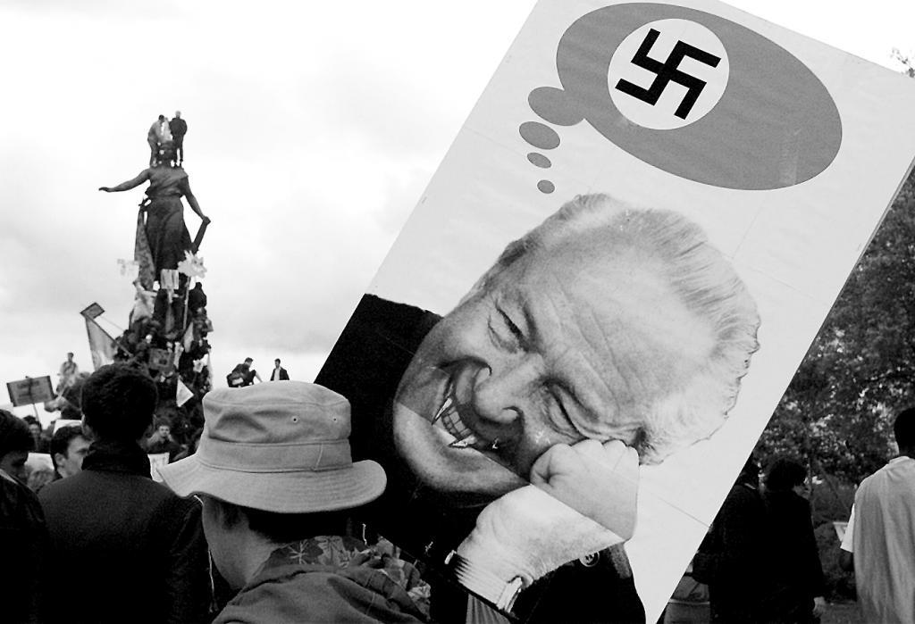 A demonstration against the National Front portrays Jean-Marie Le Pen as the devil of Nazism in 2002.
