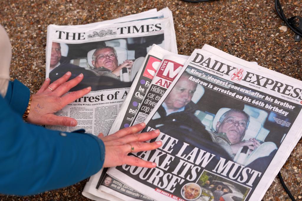 A journalist looks at today's newspaper front pages in London