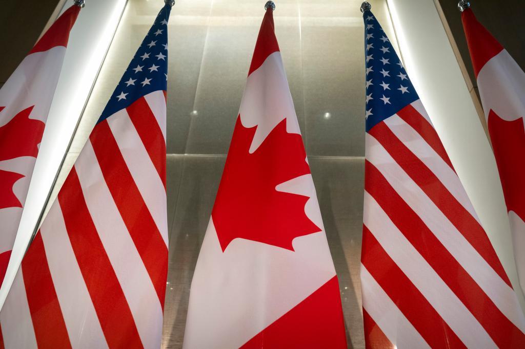 U.S. and Canadian flags.