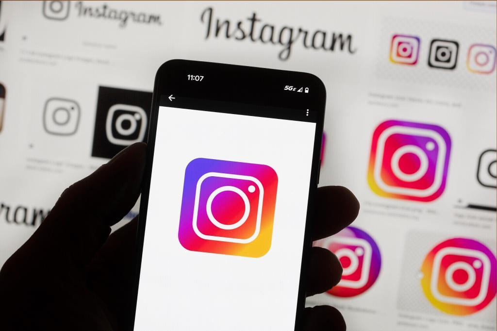The Instagram logo is seen on a cell phone