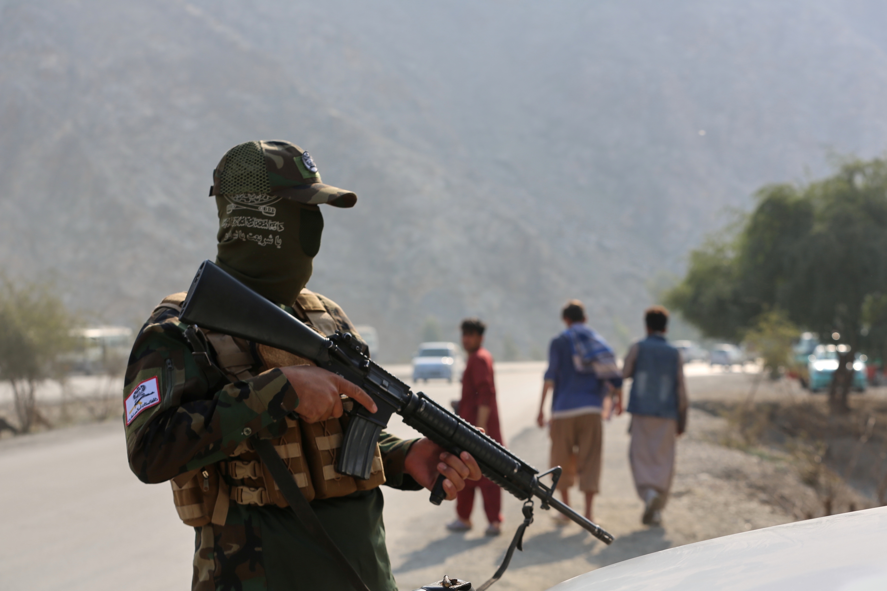 An Afghan Taliban soldier stands in guard on the Afghan side of the Torkham border crossing with Pakistan in Torkham, Afghanistan.