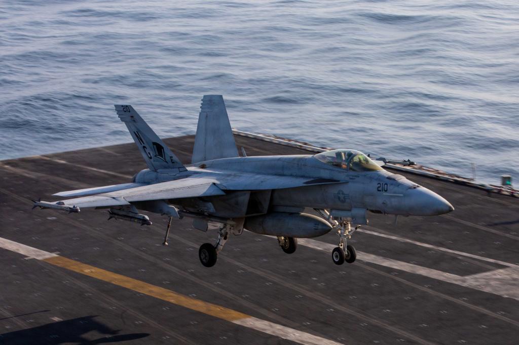 This image provided by U.S. Central Command shows a F/A-18F Super Hornet preparing to make an arrested landing on the USS Abraham Lincoln