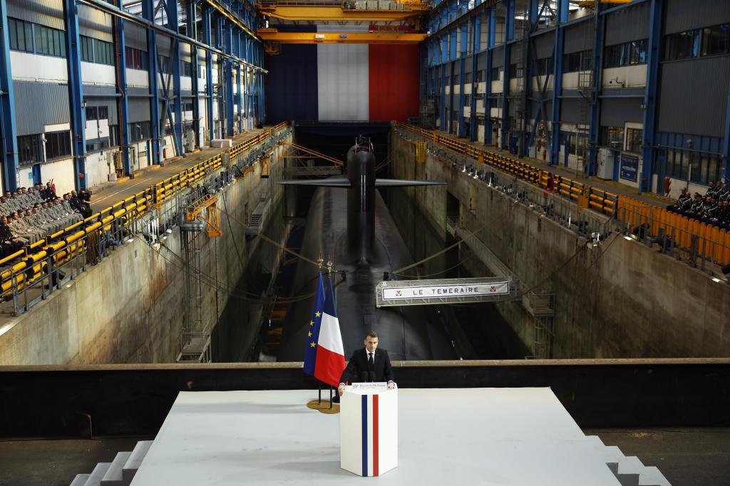 Macron delivers a speech yesterday next to a nuclear-powered ballistic missile submarine.