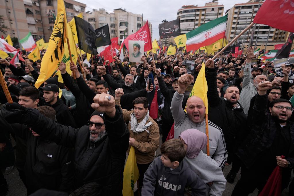 Hezbollah supporters shout slogans as they gather to mourn the death of Iranian Supreme Leader Ayatollah Ali Khamenei in the southern Suburb of Beirut