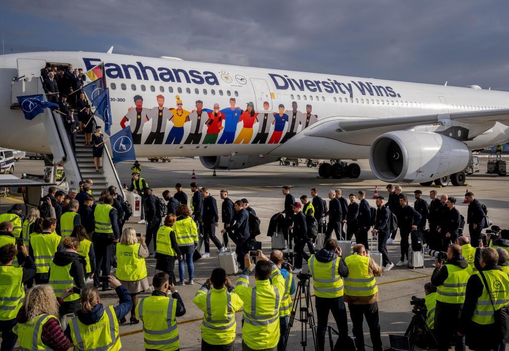 Players of German national soccer team go to the gangway before they depart to Oman