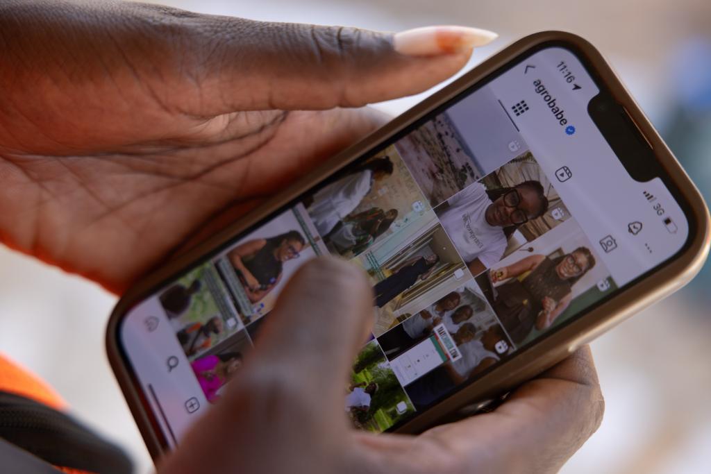 A gilr shows the instagram account of agrobabe.