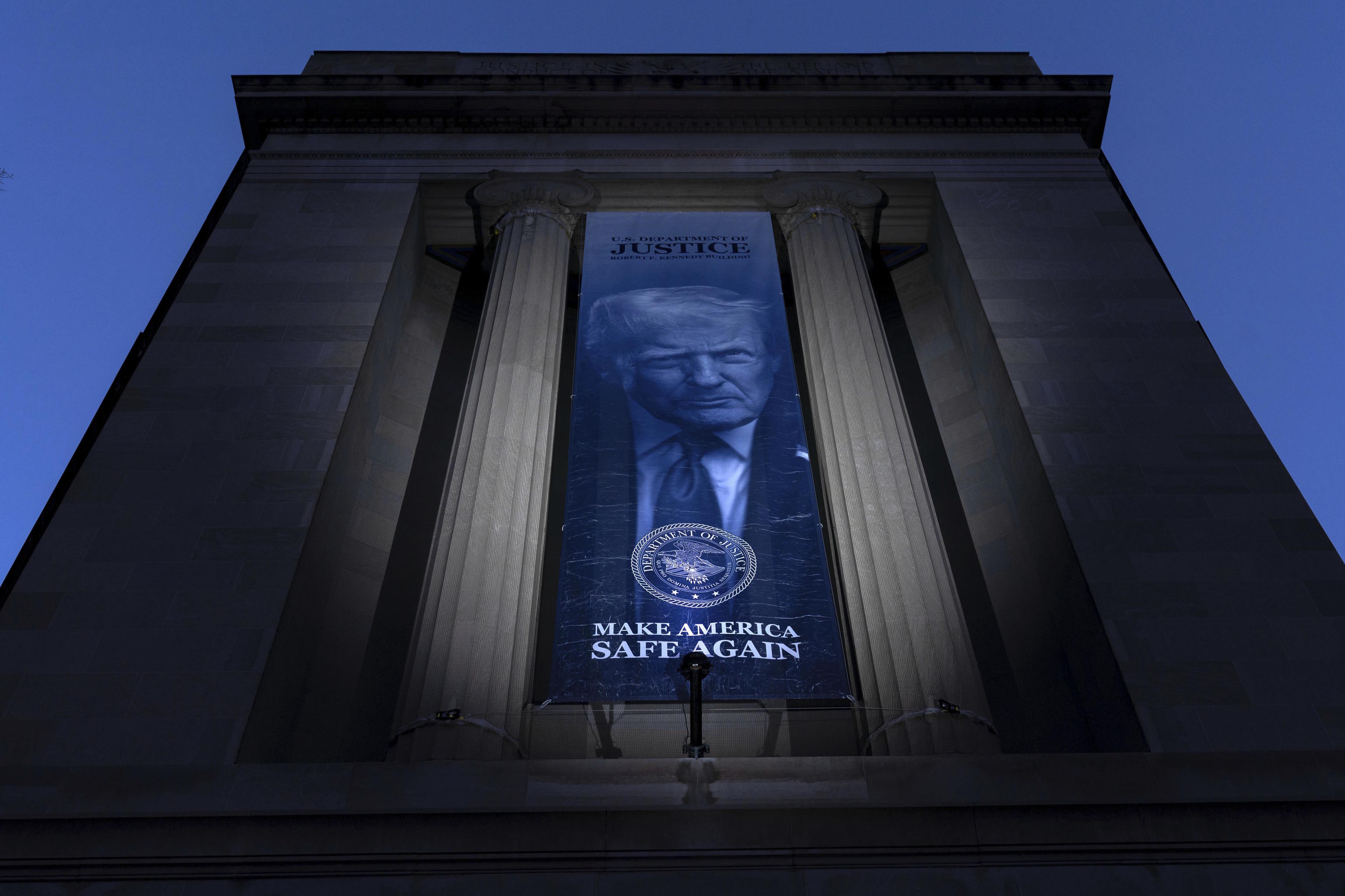 A banner with a portrait of President Donald Trump.