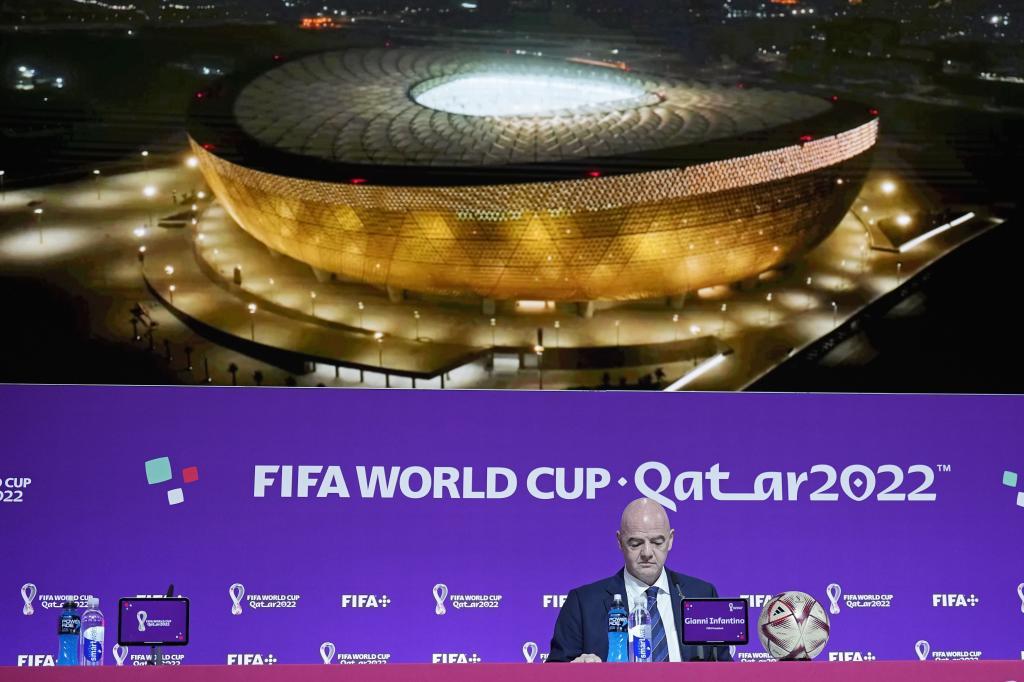 FIFA President Gianni Infantino sits in front of a screen showing the Lusail Final Stadium before he meets the media at the FIFA World Cup