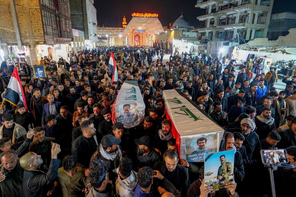 Members of the Popular Mobilization Forces attend a funeral in Najaf,