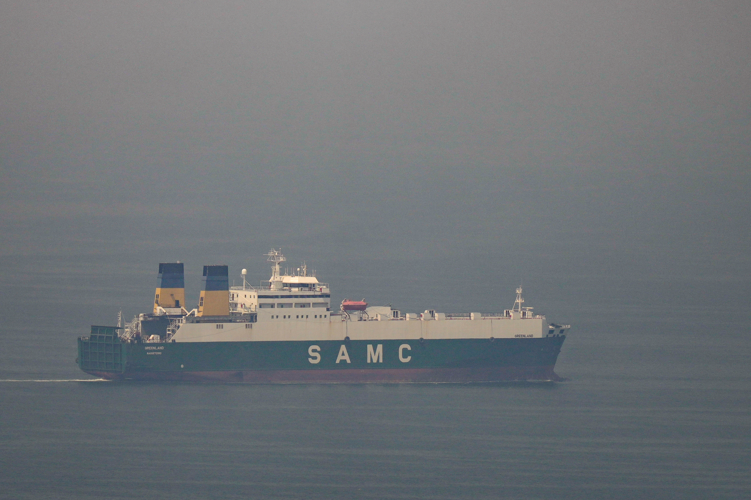 A cargo ship sails in the Arabian Gulf towards Strait of Hormuz.